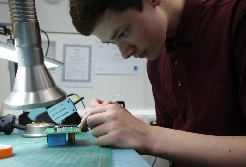 Chess Dynamics Work Experience student soldering